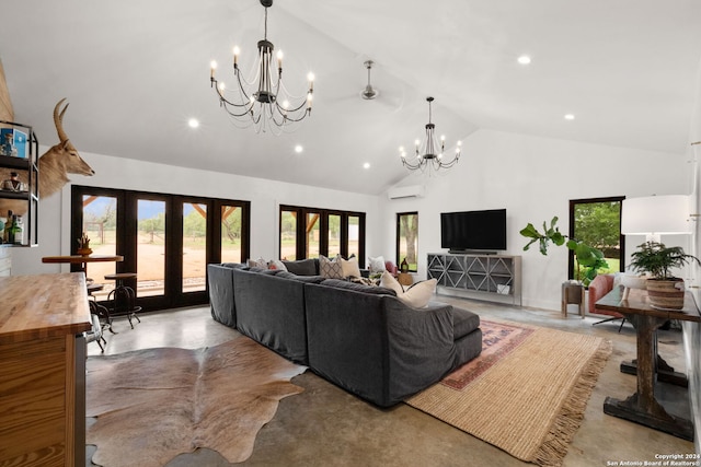 living room with high vaulted ceiling, plenty of natural light, french doors, and a wall mounted air conditioner