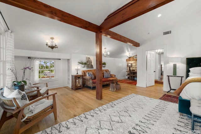 bedroom featuring vaulted ceiling with beams, a notable chandelier, and light hardwood / wood-style flooring