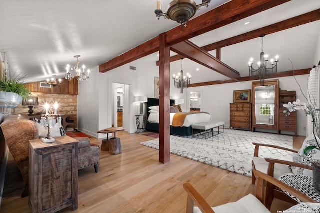 living room with a notable chandelier, beamed ceiling, and light wood-type flooring