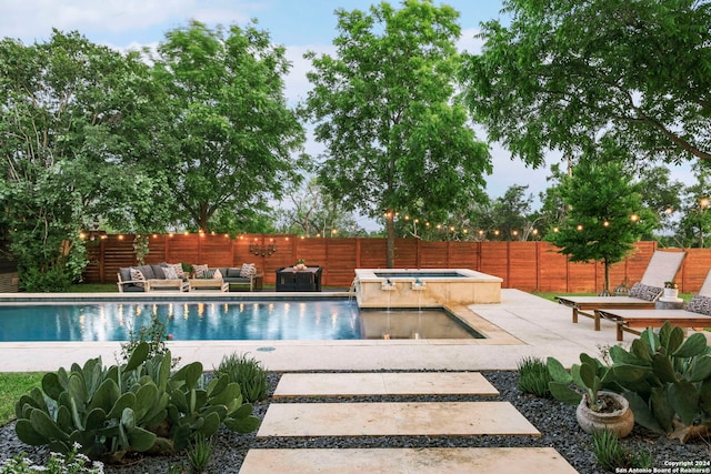 view of swimming pool with a patio area, outdoor lounge area, and an in ground hot tub