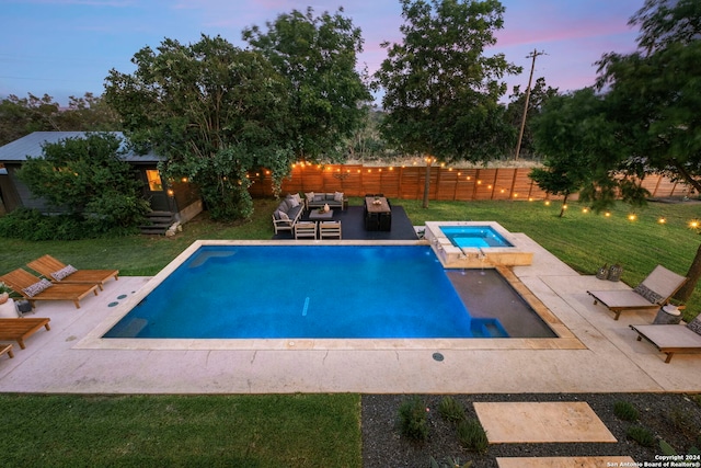 pool at dusk featuring an outdoor living space, an in ground hot tub, a lawn, and a patio