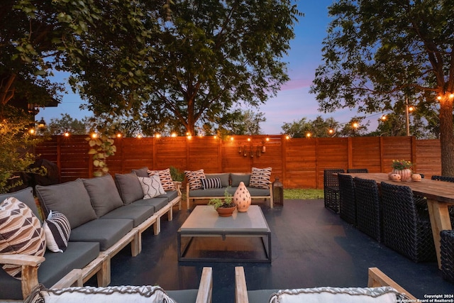 patio terrace at dusk with an outdoor living space