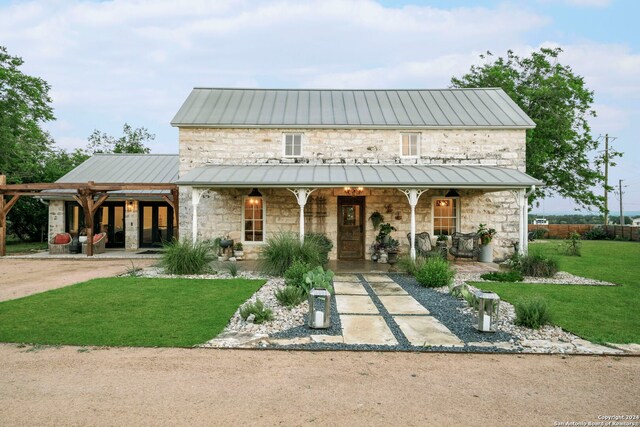 surrounding community featuring a lawn and an outdoor fire pit