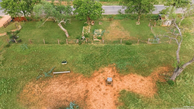 birds eye view of property with a rural view