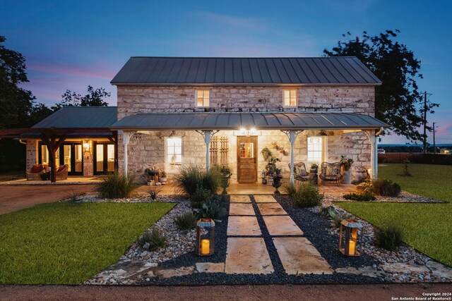 yard at dusk with a fire pit and a patio