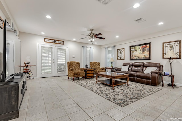 living room featuring ceiling fan, french doors, and a healthy amount of sunlight