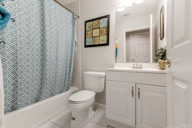 full bathroom featuring tile patterned floors, toilet, vanity, and shower / bath combo