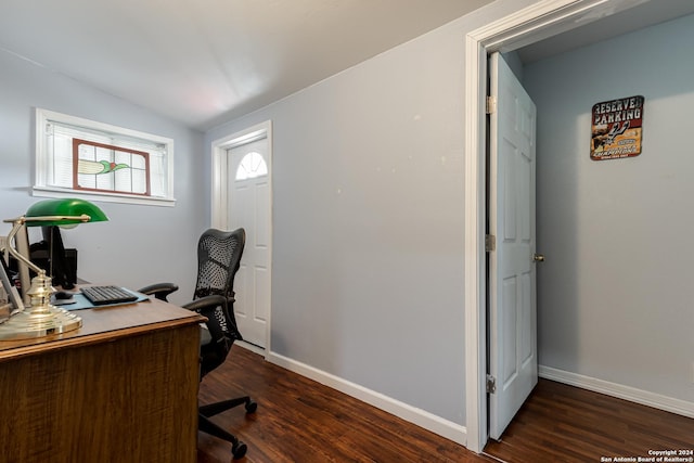 office space featuring vaulted ceiling and dark hardwood / wood-style floors