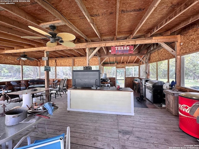 wooden terrace featuring ceiling fan