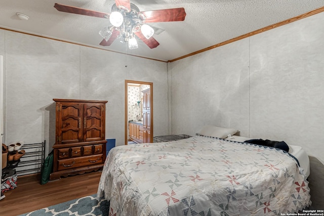 bedroom featuring hardwood / wood-style flooring, ornamental molding, ceiling fan, and a textured ceiling