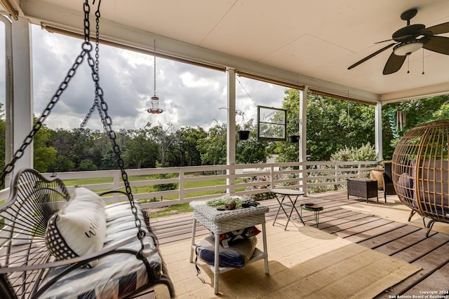 sunroom with plenty of natural light and ceiling fan