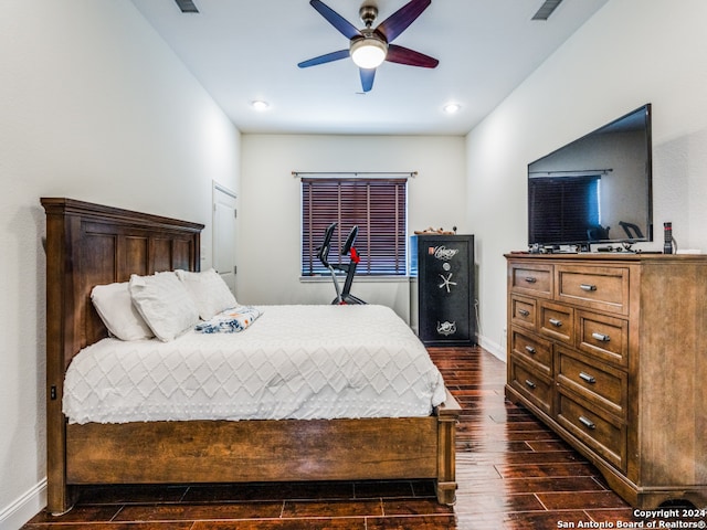 bedroom with dark wood-type flooring and ceiling fan