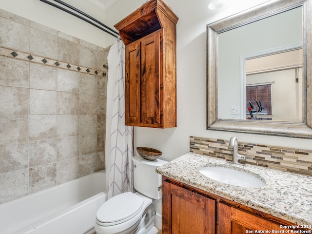 full bathroom featuring vanity, tiled shower / bath combo, toilet, and backsplash