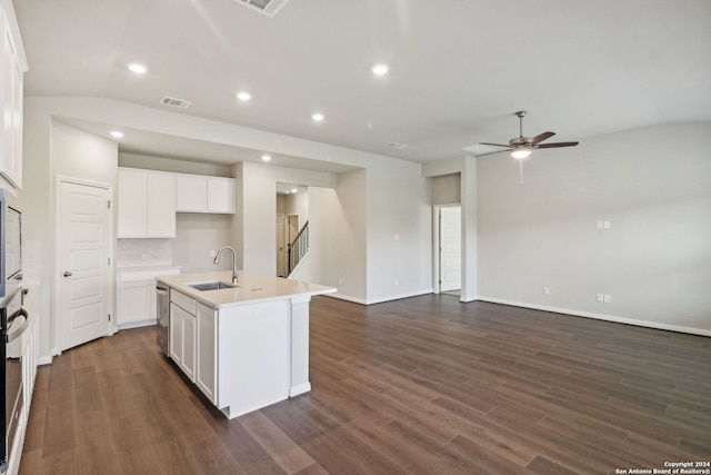 kitchen featuring sink, stainless steel dishwasher, an island with sink, decorative backsplash, and white cabinets