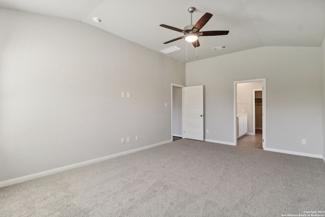 unfurnished bedroom featuring lofted ceiling, ceiling fan, and carpet flooring