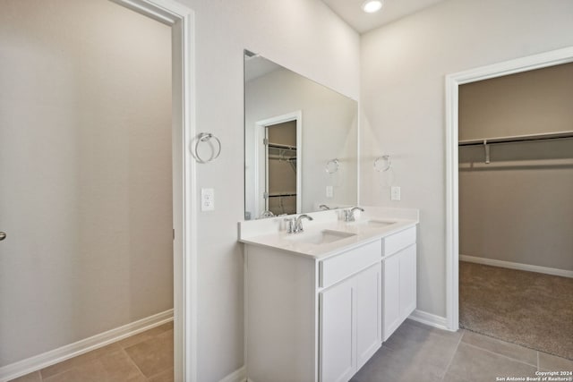 bathroom with tile patterned floors and vanity