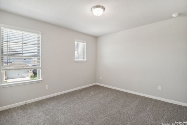 empty room with carpet flooring