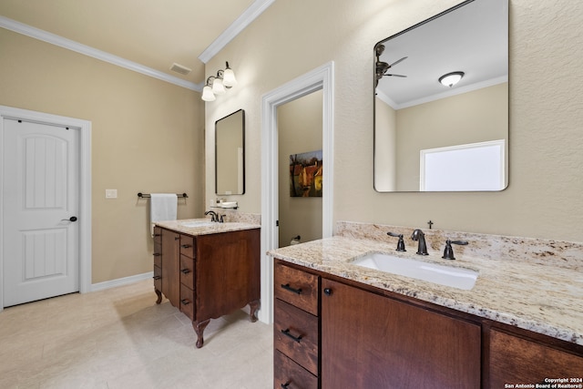 bathroom featuring double vanity, crown molding, ceiling fan, and tile patterned floors