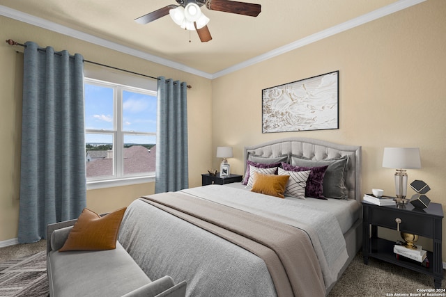 carpeted bedroom featuring ornamental molding and ceiling fan