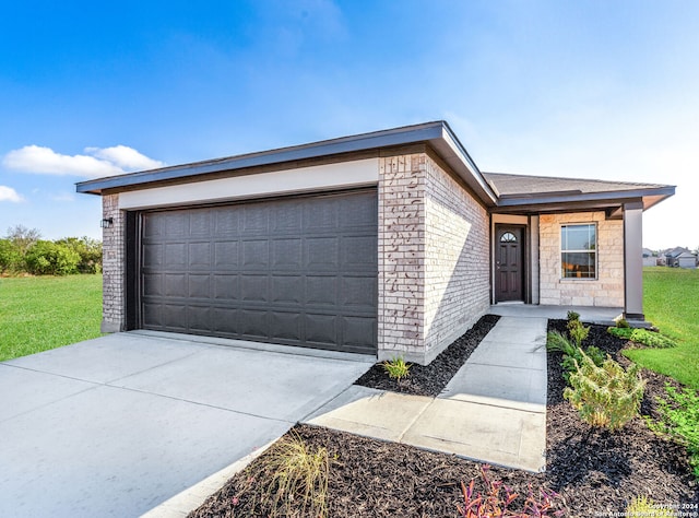 ranch-style home featuring a garage and a front lawn