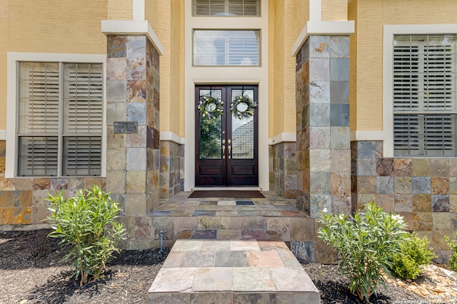 entrance to property featuring french doors