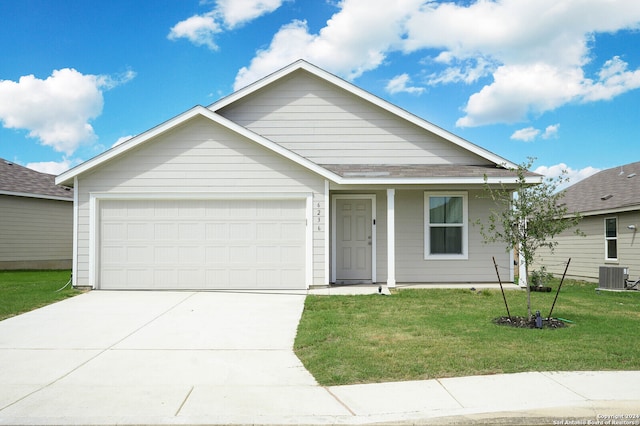 view of front of home featuring a garage, a front lawn, and cooling unit