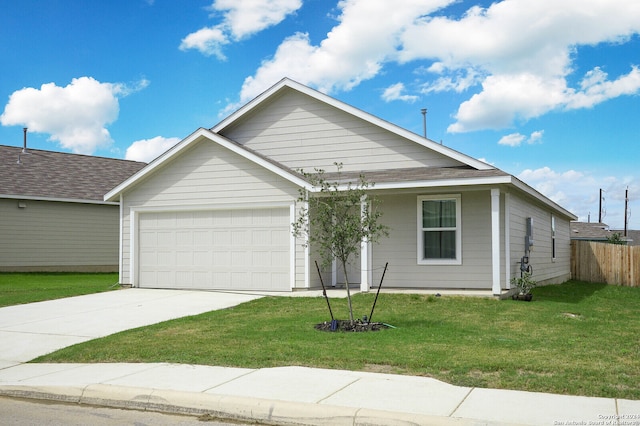 view of front of property with a garage and a front yard