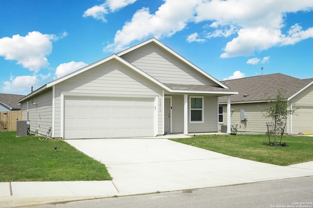 view of front of home featuring a garage, central AC, and a front yard