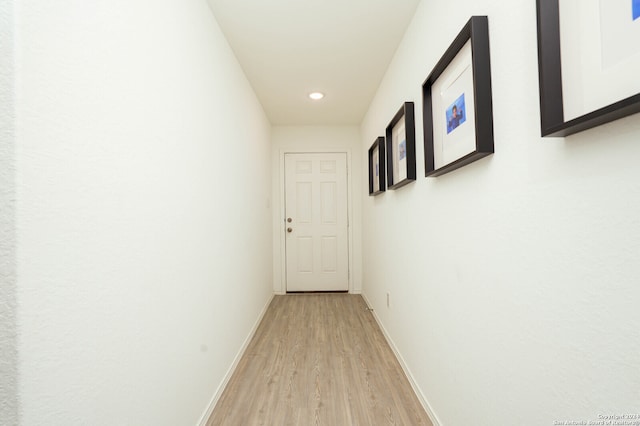 corridor featuring light hardwood / wood-style floors