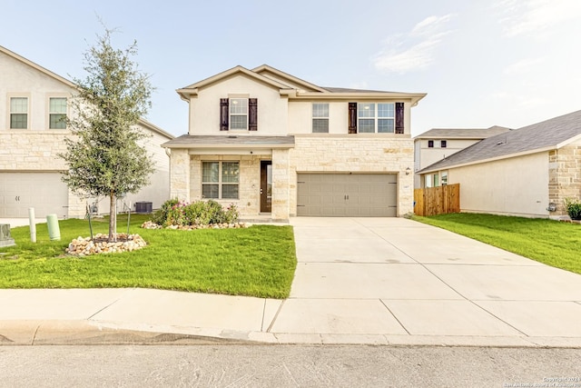 view of front of home with cooling unit, a garage, and a front lawn