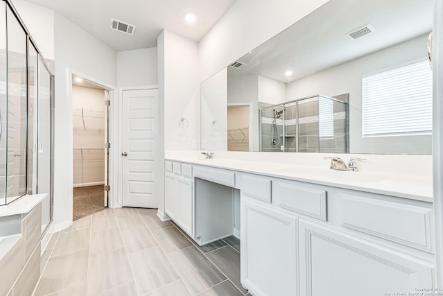 bathroom featuring vanity and walk in shower