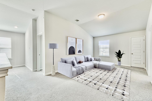 unfurnished living room with hardwood / wood-style flooring, ceiling fan, sink, and vaulted ceiling