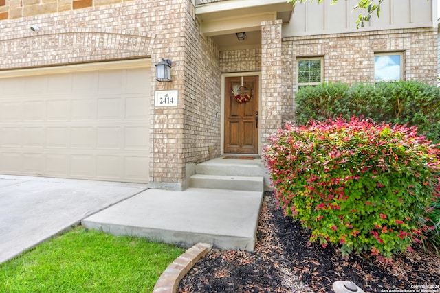 doorway to property featuring a garage