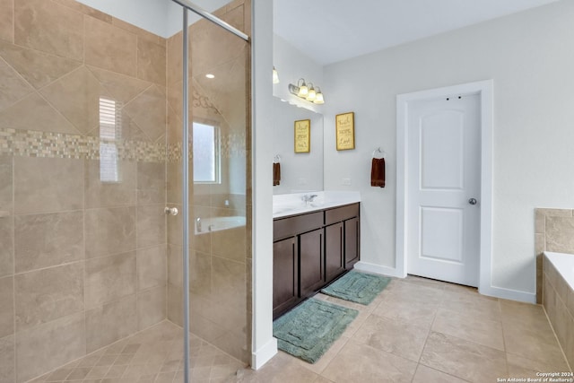 bathroom featuring tile patterned floors, vanity, and independent shower and bath