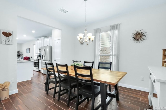 dining space featuring a chandelier