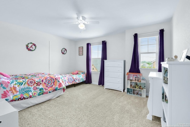 carpeted bedroom featuring ceiling fan