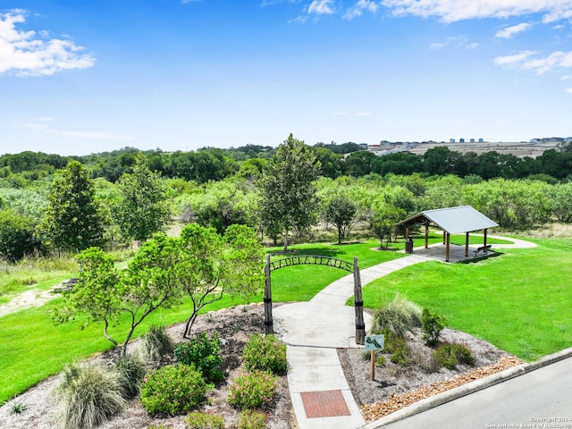 surrounding community with a yard and a gazebo