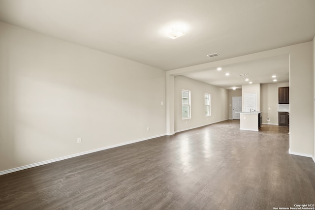 unfurnished living room featuring hardwood / wood-style floors