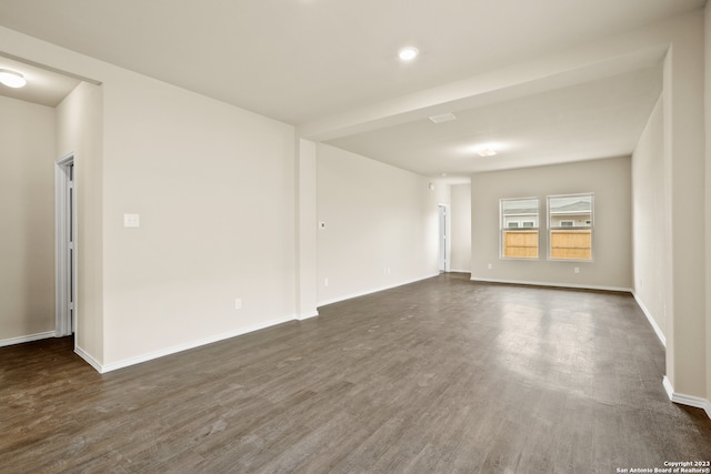 empty room with dark hardwood / wood-style floors