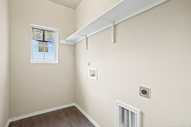 washroom featuring hookup for a gas dryer, wood-type flooring, electric dryer hookup, and washer hookup