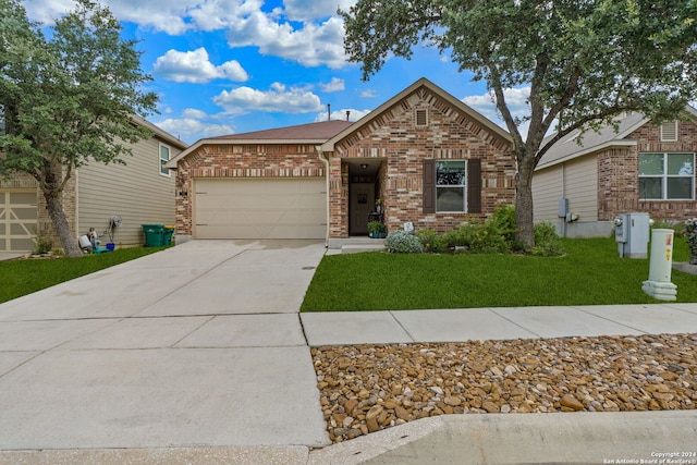 view of front of property featuring a garage and a front lawn