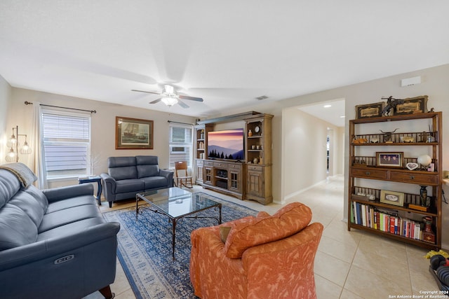 tiled living room with ceiling fan