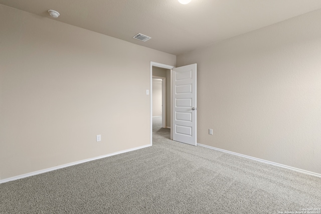 unfurnished room featuring carpet flooring