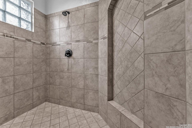 bathroom with a tile shower