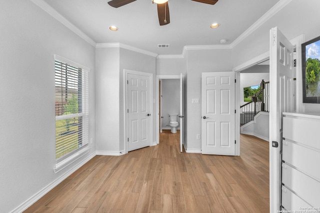 unfurnished bedroom featuring crown molding, ceiling fan, and light hardwood / wood-style floors