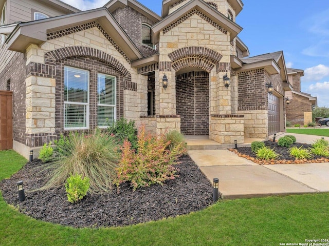 doorway to property featuring a garage