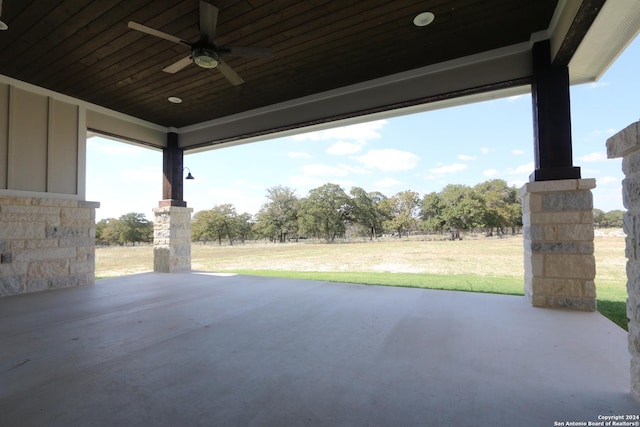 view of patio featuring ceiling fan