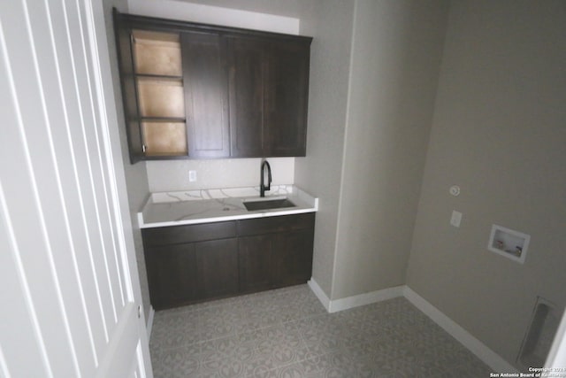 kitchen with dark brown cabinets and sink