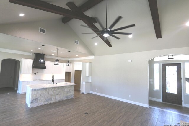 unfurnished bedroom featuring ceiling fan, hardwood / wood-style flooring, a closet, and crown molding