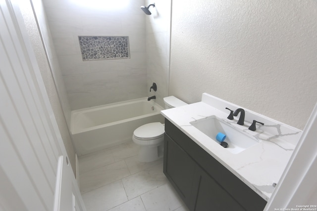 full bathroom featuring tiled shower / bath combo, vanity, and toilet